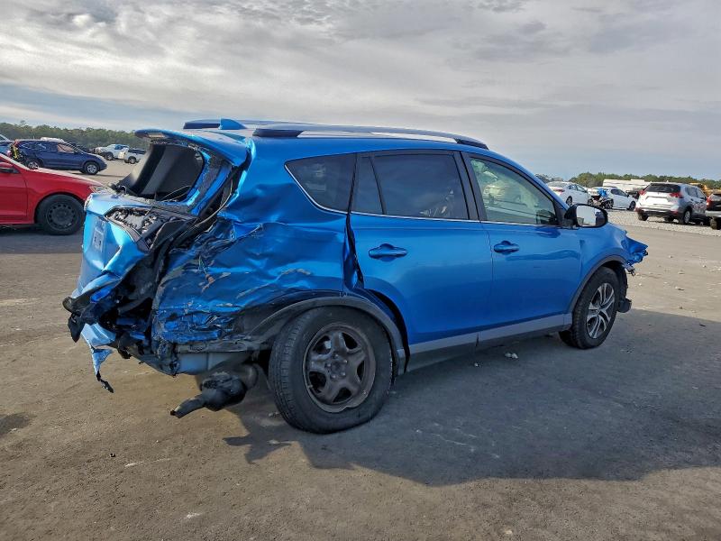 Photo 3 from auction – 2018 TOYOTA RAV4 LE with VIN JTMZFREV2JJ158480