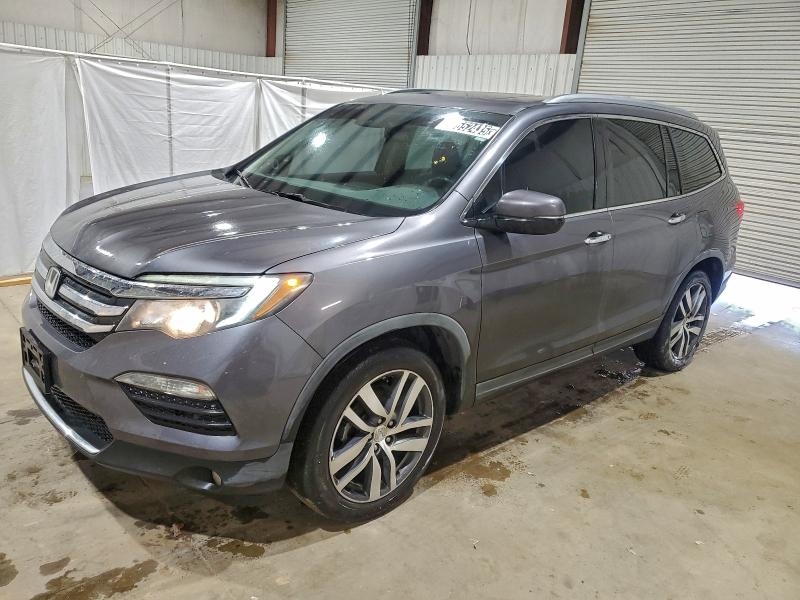 HONDA PILOT TOUR 2017 with VIN 5FNYF5H97HB024245 - Photo from auction