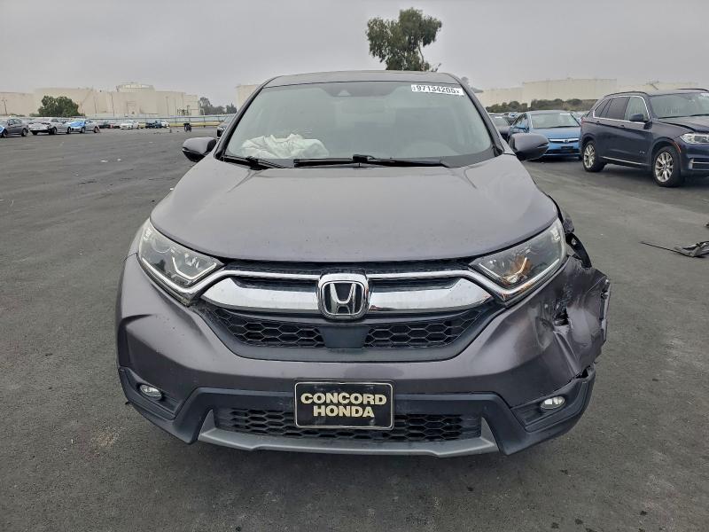 Photo 5 from auction – 2018 HONDA CR-V with VIN 7FARW1H83JE034107