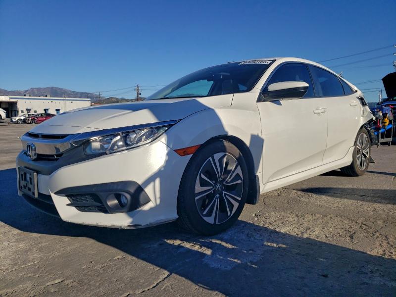 HONDA CIVIC EX 2018 with VIN JHMFC1F32JX039012 - Photo from auction