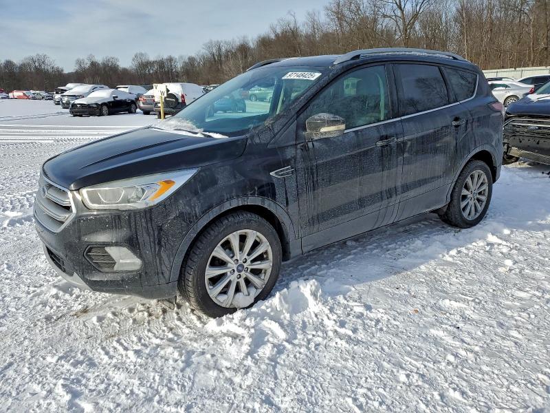 FORD ESCAPE TIT 2017 с VIN 1FMCU0JD8HUE32001 - Фото с аукциона