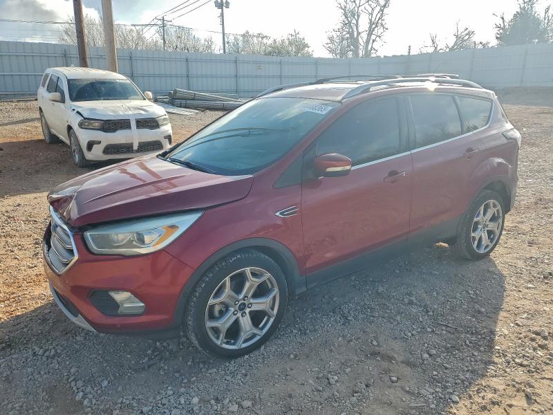FORD ESCAPE TIT 2017 with VIN 1FMCU0J95HUD53204 - Photo from auction