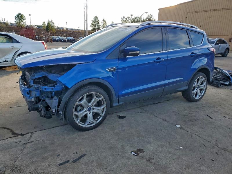 FORD ESCAPE TIT 2017 with VIN 1FMCU0J94HUF02704 - Photo from auction