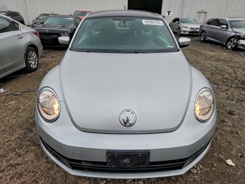 Photo 5 from auction – 2014 VOLKSWAGEN BEETLE with VIN 3VWJP7AT8EM605631
