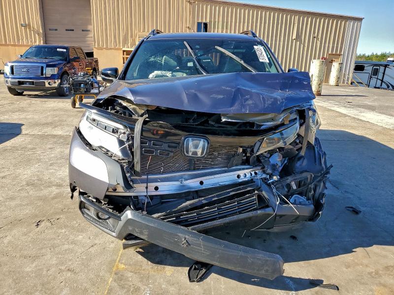 Photo 5 from auction – 2020 HONDA PASSPORT T with VIN 5FNYF7H97LB004792
