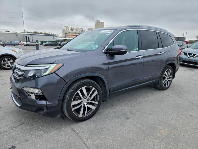 HONDA PILOT TOUR 2018 with VIN 5FNYF5H90JB030152 - Photo from auction