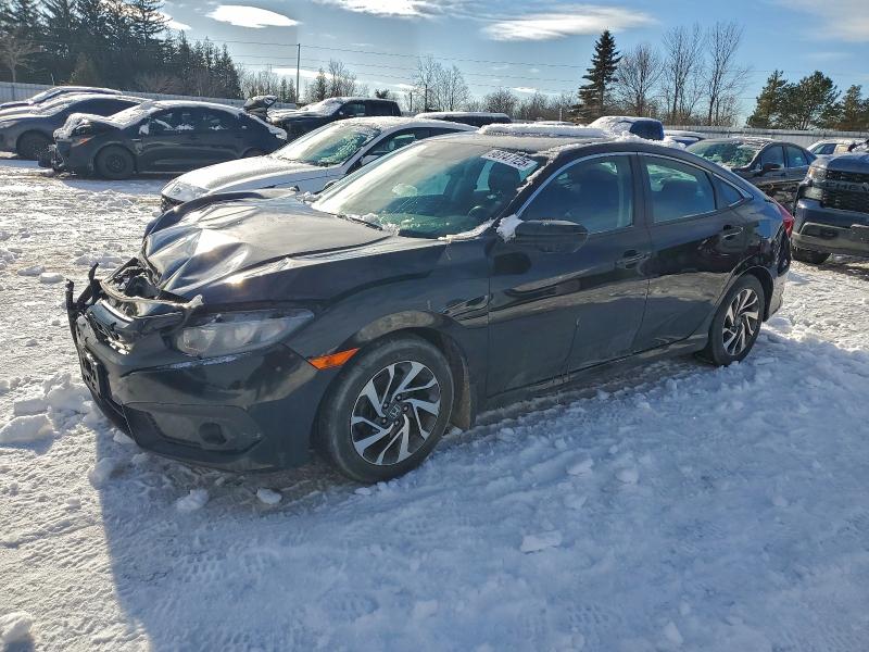 HONDA CIVIC LX 2018 with VIN 2HGFC2F60JH021101 - Photo from auction