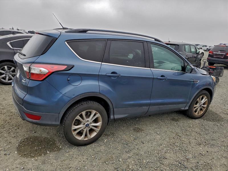 Photo 3 from auction – 2018 FORD ESCAPE SE with VIN 1FMCU9GD8JUC48940