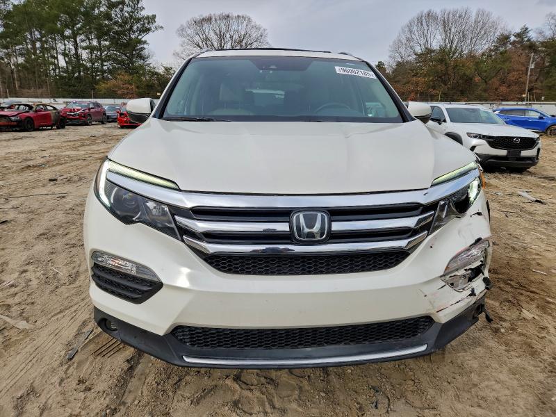 Photo 5 from auction – 2018 HONDA PILOT ELIT with VIN 5FNYF6H04JB015368