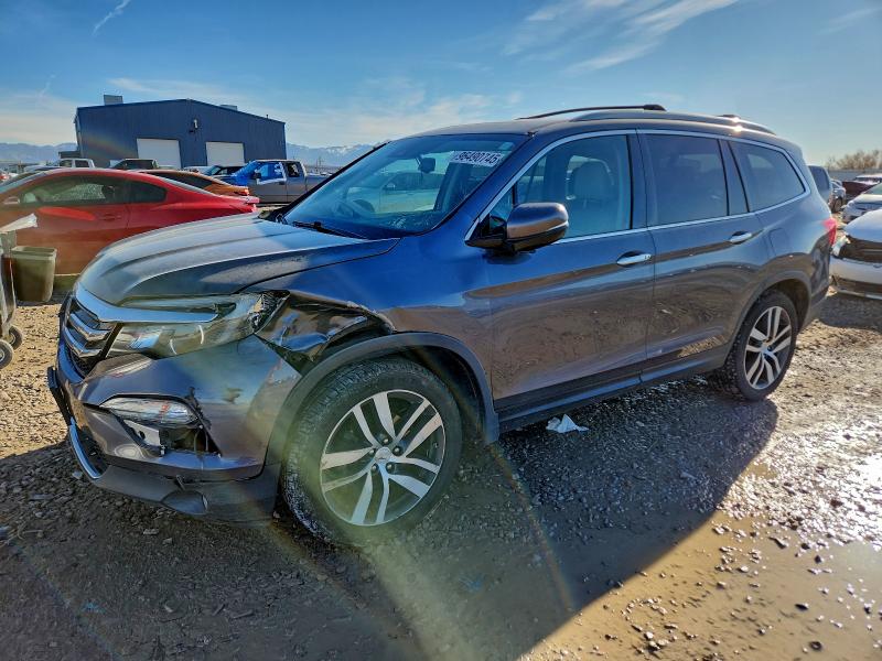 HONDA PILOT TOUR 2016 with VIN 5FNYF6H98GB011346 - Photo from auction