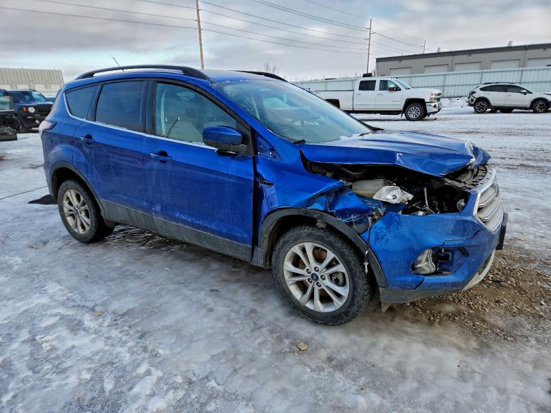 Photo 4 from auction – 2017 FORD ESCAPE SE with VIN 1FMCU9G98HUE57858