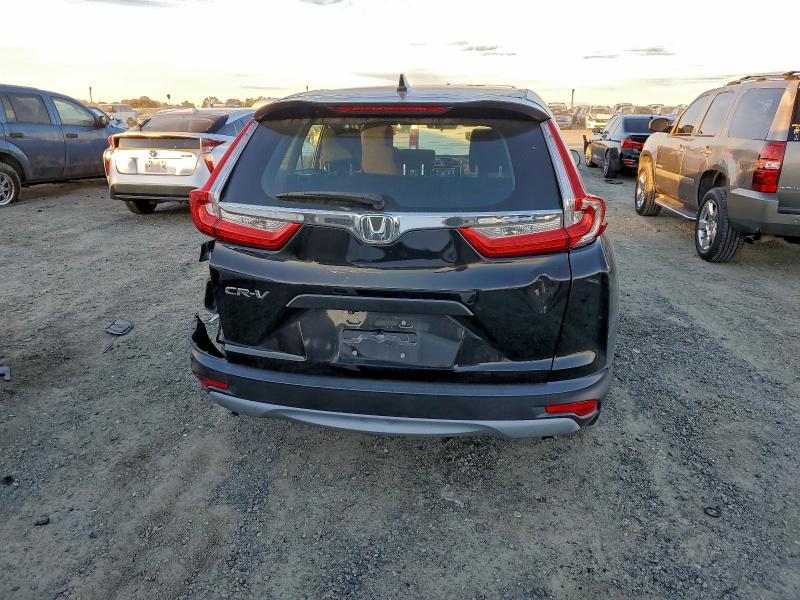 Photo 6 from auction – 2017 HONDA CR-V LX with VIN 7FARW5H38HE011136