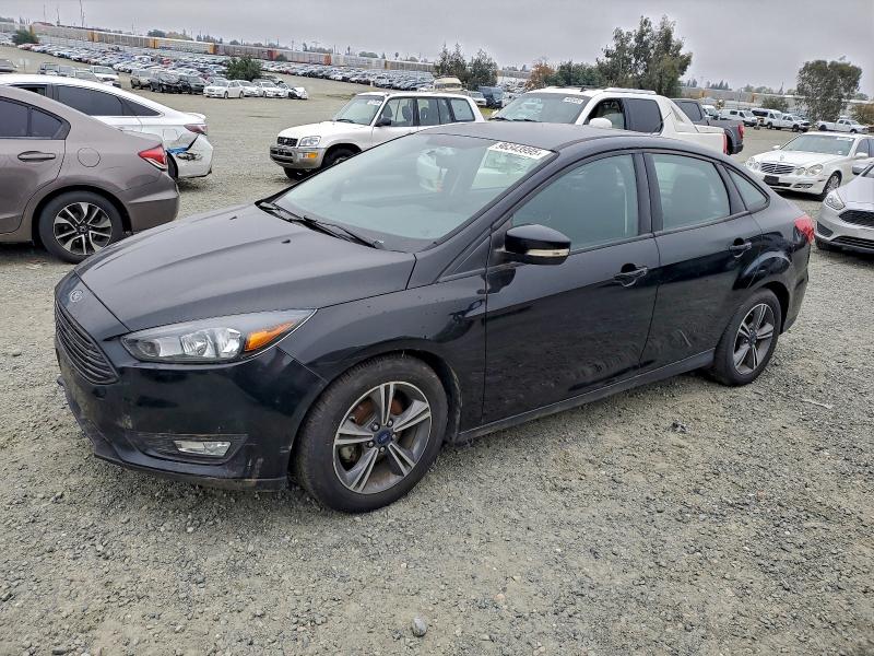 FORD FOCUS SE 2016 with VIN 1FADP3FEXGL311290 - Photo from auction