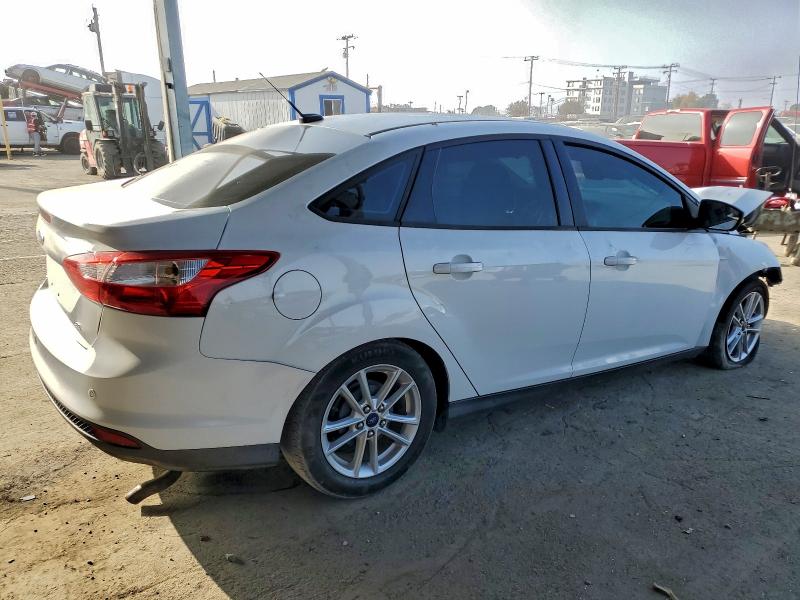 Фото 3 с аукциона – 2014 FORD FOCUS SE с VIN 1FADP3F20EL219284