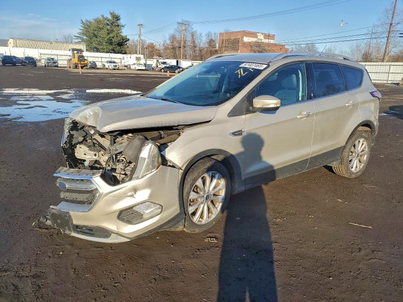 FORD ESCAPE TIT 2017 with VIN 1FMCU9JD8HUC57950 - Photo from auction