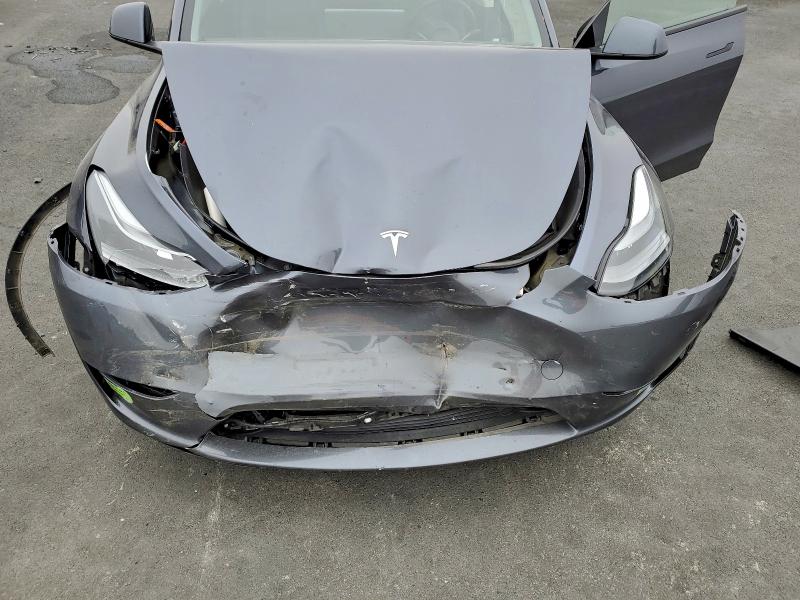 Photo 11 from auction – 2023 TESLA MODEL Y with VIN 7SAYGDEE2PF690360