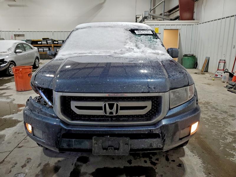 Photo 5 from auction – 2011 HONDA RIDGELINE with VIN 5FPYK1F59BB004517