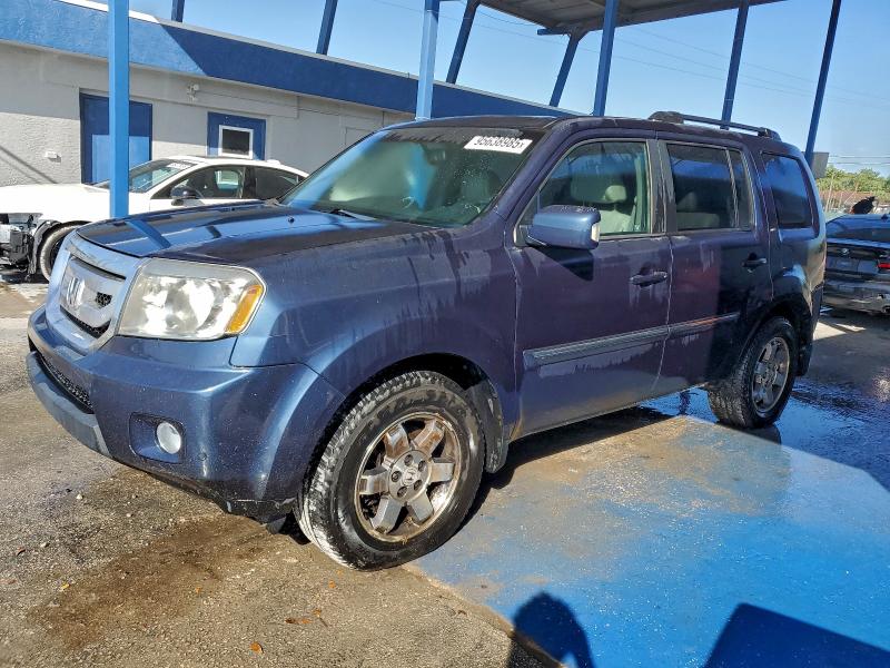 Photo 1 from auction – 2010 HONDA PILOT TOUR with VIN 5FNYF3H99AB014911