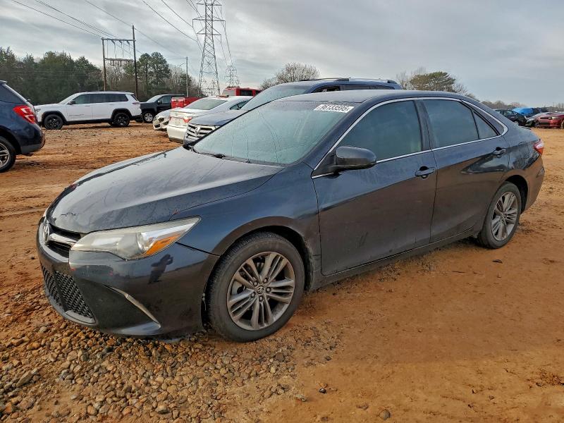 TOYOTA CAMRY LE 2015 with VIN 4T1BF1FKXFU067594 - Photo from auction
