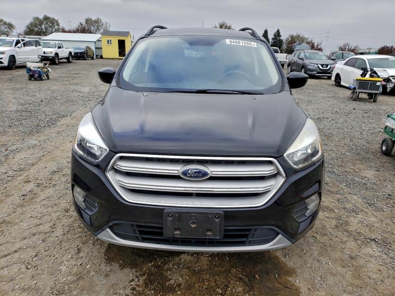 Photo 5 from auction – 2018 FORD ESCAPE SE with VIN 1FMCU0GD0JUC36969