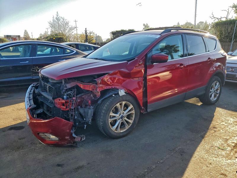 FORD ESCAPE SE 2018 with VIN 1FMCU9GD5JUB28075 - Photo from auction