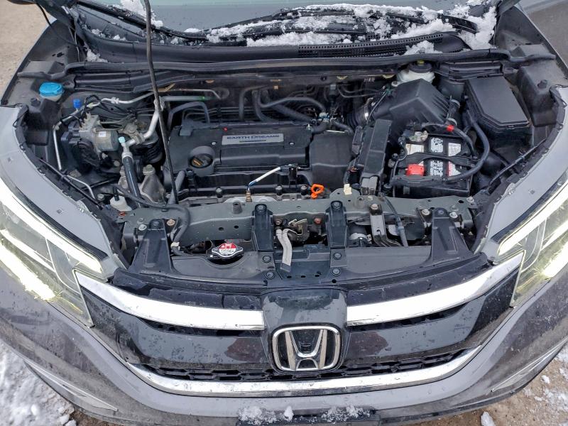 Photo 12 from auction – 2015 HONDA CR-V EX with VIN 2HKRM4H50FH102476