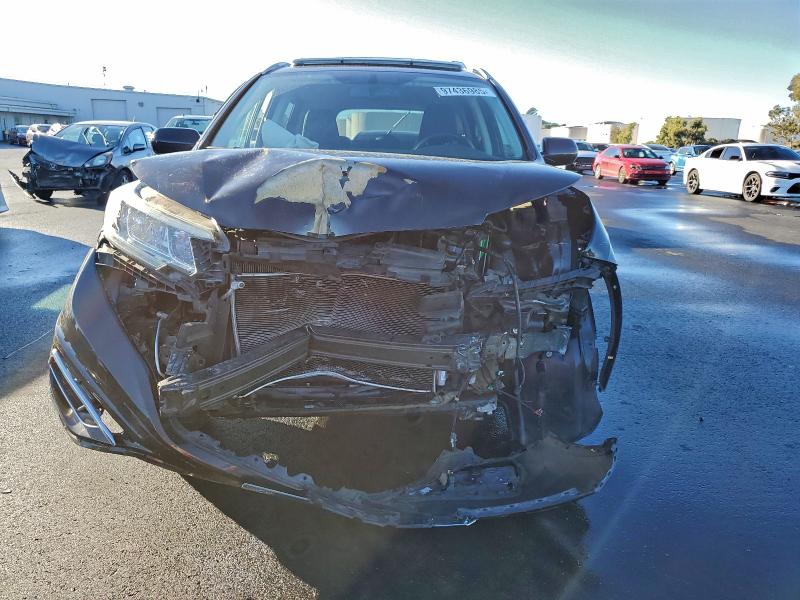 Photo 5 from auction – 2015 HONDA CR-V EXL with VIN 2HKRM3H77FH502224