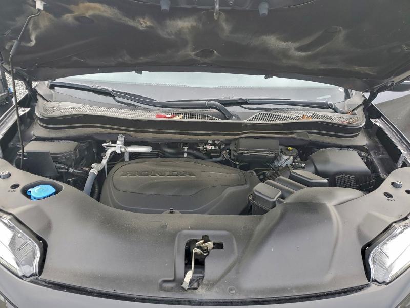 Photo 12 from auction – 2021 HONDA PASSPORT E with VIN 5FNYF8H51MB032480