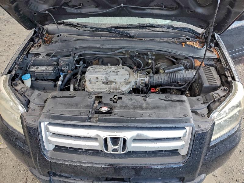 Photo 12 from auction – 2006 HONDA PILOT LX with VIN 2HKYF18116H555930