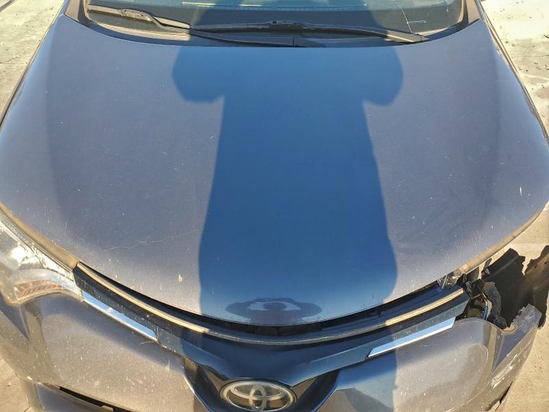 Photo 12 from auction – 2018 TOYOTA RAV4 LE with VIN JTMZFREV0JJ752307