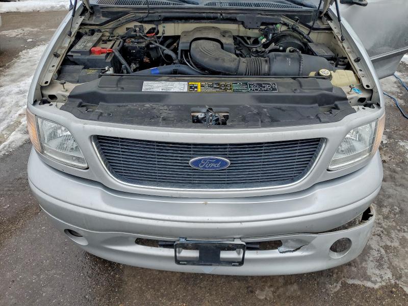 Photo 11 from auction – 2003 FORD F150 with VIN 2FTRX18W03CA82598