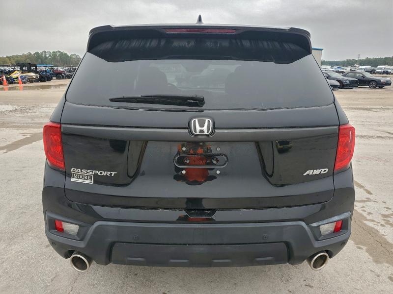 Photo 6 from auction – 2022 HONDA PASSPORT E with VIN 5FNYF8H53NB009333