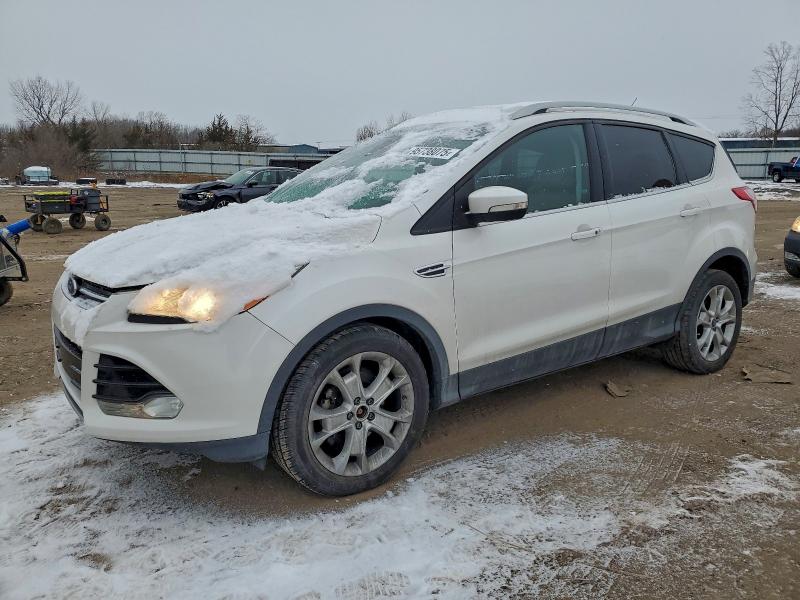 FORD ESCAPE TIT 2014 with VIN 1FMCU0JX0EUC89700 - Photo from auction