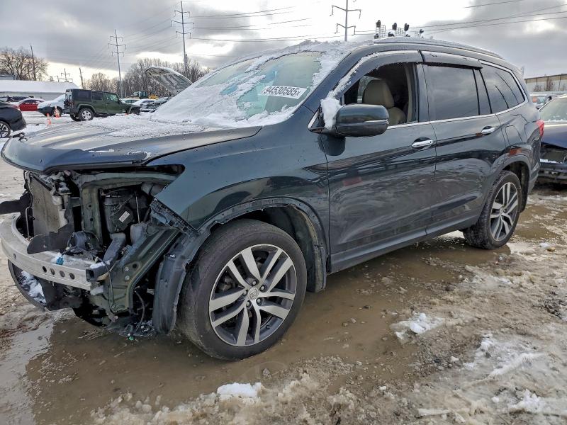 HONDA PILOT ELIT 2016 с VIN 5FNYF6H02GB090367 - Фото с аукциона