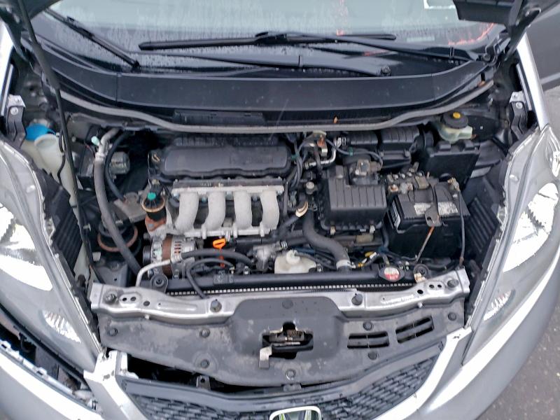 Photo 11 from auction – 2009 HONDA FIT with VIN JHMGE88239S009294
