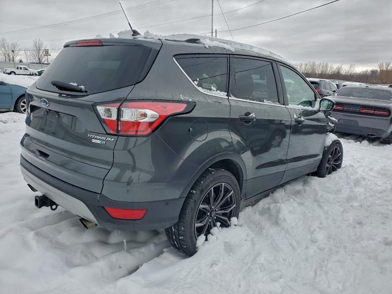 Photo 3 from auction – 2018 FORD ESCAPE TIT with VIN 1FMCU9J94JUC33646