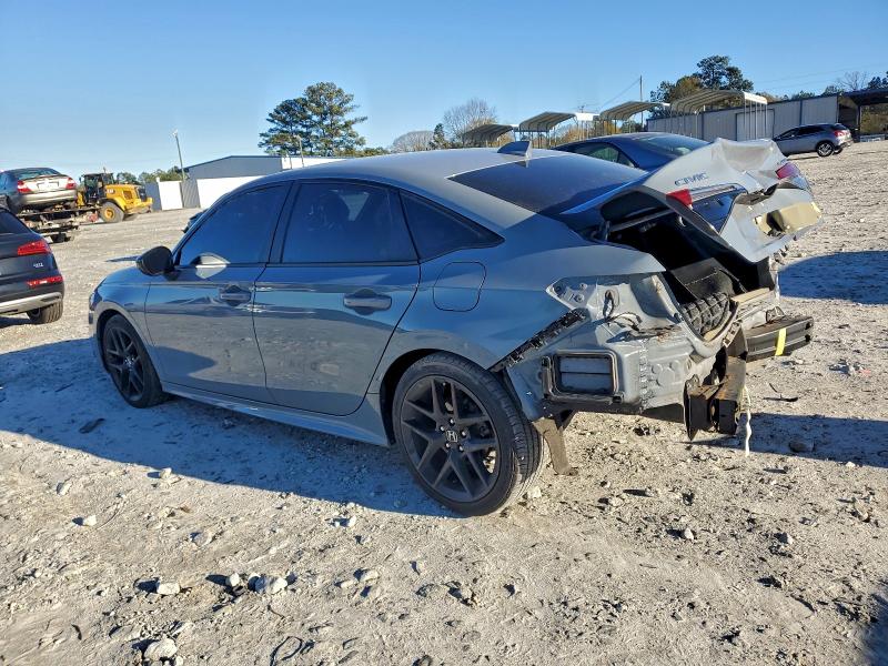 Photo 2 from auction – 2022 HONDA CIVIC SPOR with VIN 2HGFE2F58NH502950