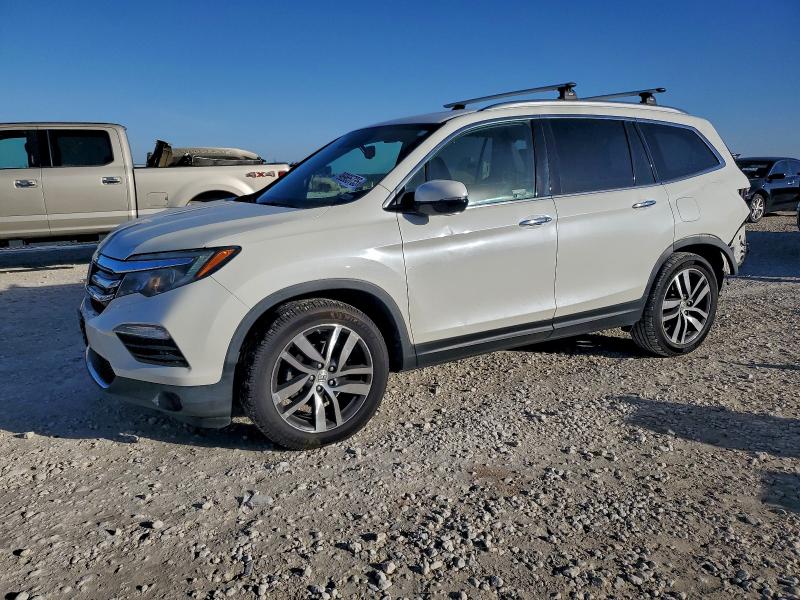 HONDA PILOT TOUR 2017 with VIN 5FNYF5H98HB027218 - Photo from auction