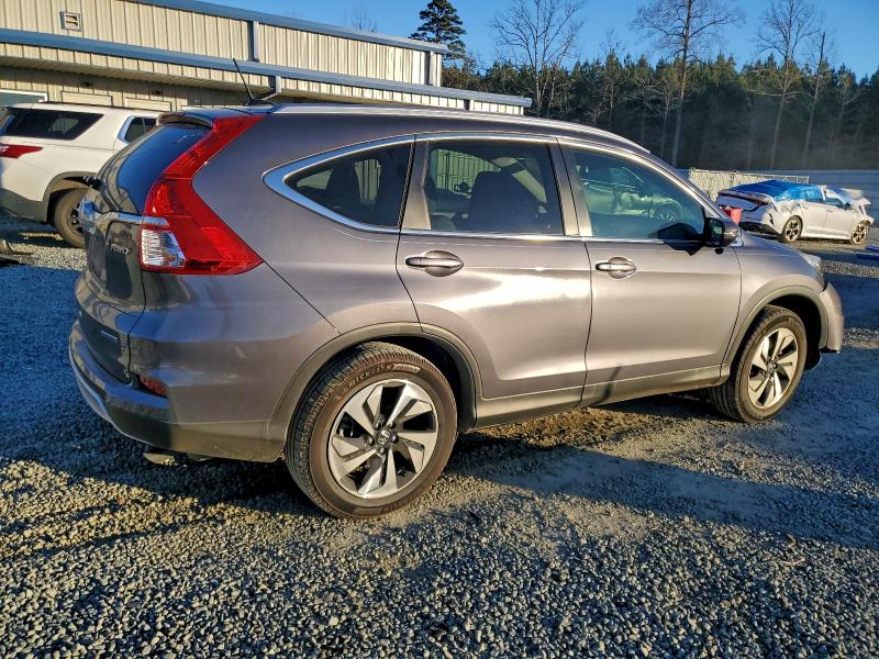 Photo 3 from auction – 2015 HONDA CR-V TOURI with VIN 5J6RM4H98FL069641
