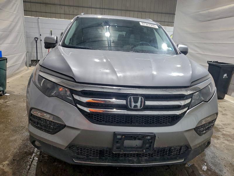 Photo 5 from auction – 2016 HONDA PILOT TOUR with VIN 5FNYF6H94GB104817