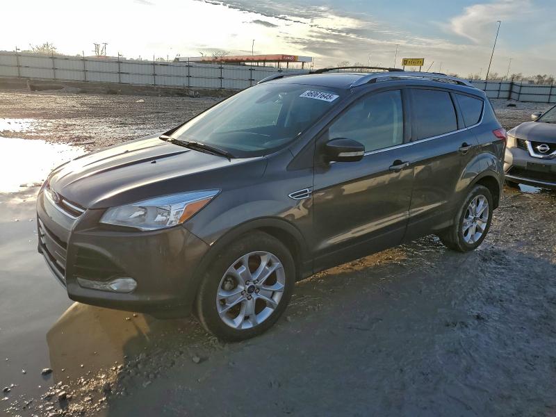 FORD ESCAPE TIT 2016 with VIN 1FMCU0JX1GUC75162 - Photo from auction