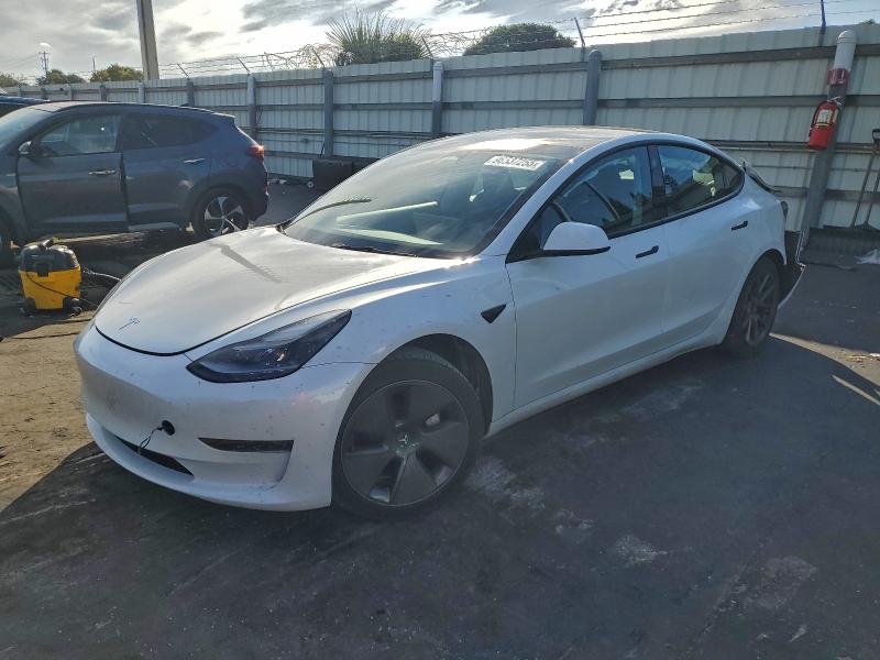 TESLA MODEL 3 2023 with VIN 5YJ3E1EA9PF574890 - Photo from auction