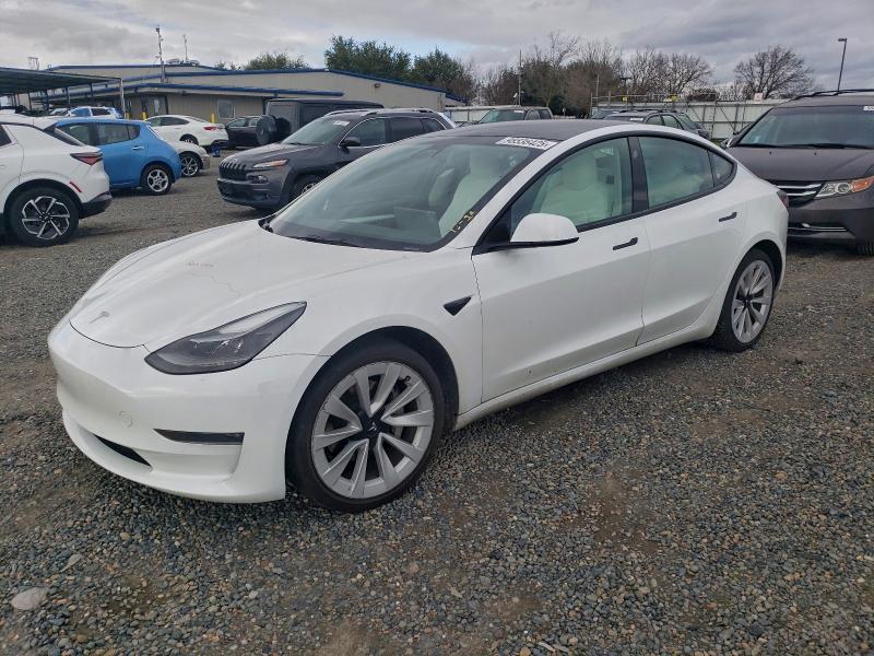 TESLA MODEL 3 2022 with VIN 5YJ3E1EB7NF129828 - Photo from auction