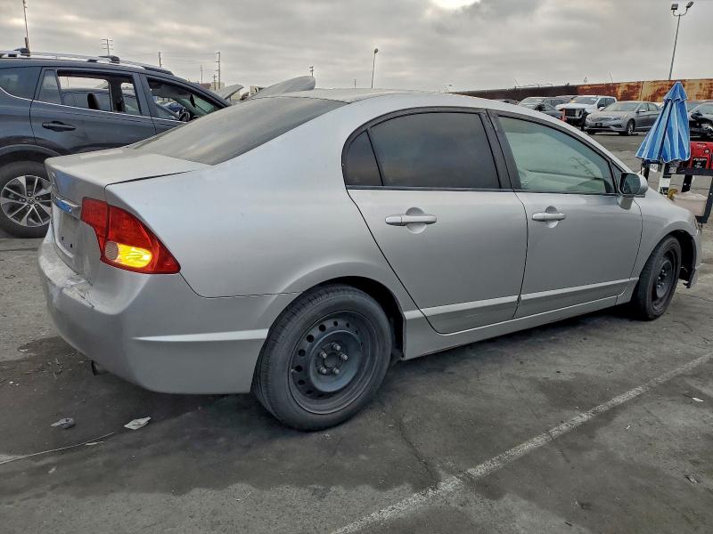 Photo 3 from auction – 2011 HONDA CIVIC LX with VIN 19XFA1F54BE027762