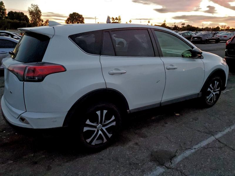 Photo 3 from auction – 2017 TOYOTA RAV4 LE with VIN JTMZFREV9HJ718523