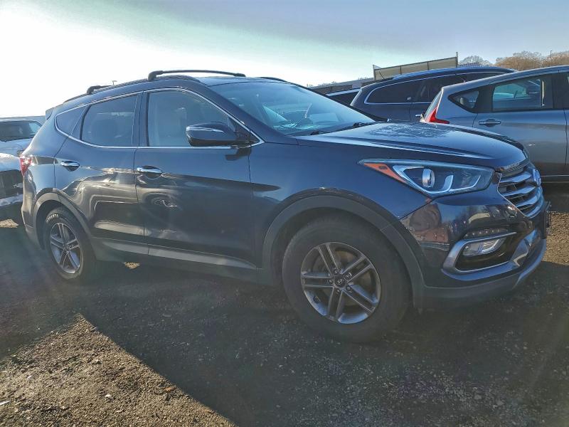 Photo 4 from auction – 2017 HYUNDAI SANTA FE S with VIN 5NMZU3LB6HH020209