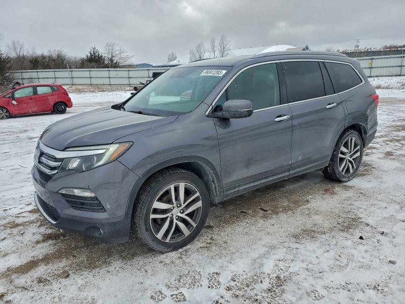 Photo 1 from auction – 2017 HONDA PILOT TOUR with VIN 5FNYF6H98HB021070