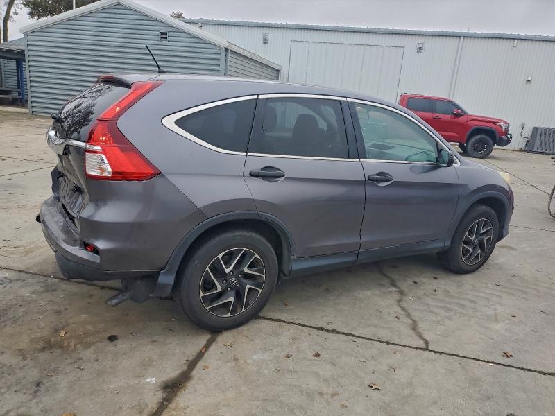 Photo 3 from auction – 2016 HONDA CR-V with VIN 2HKRM3H40GH508230