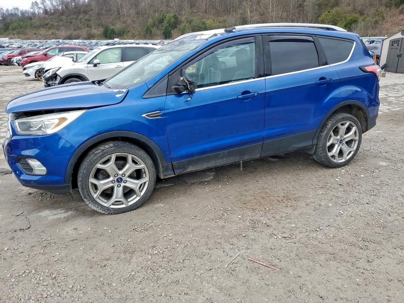 FORD ESCAPE TIT 2018 with VIN 1FMCU9J90JUC28167 - Photo from auction