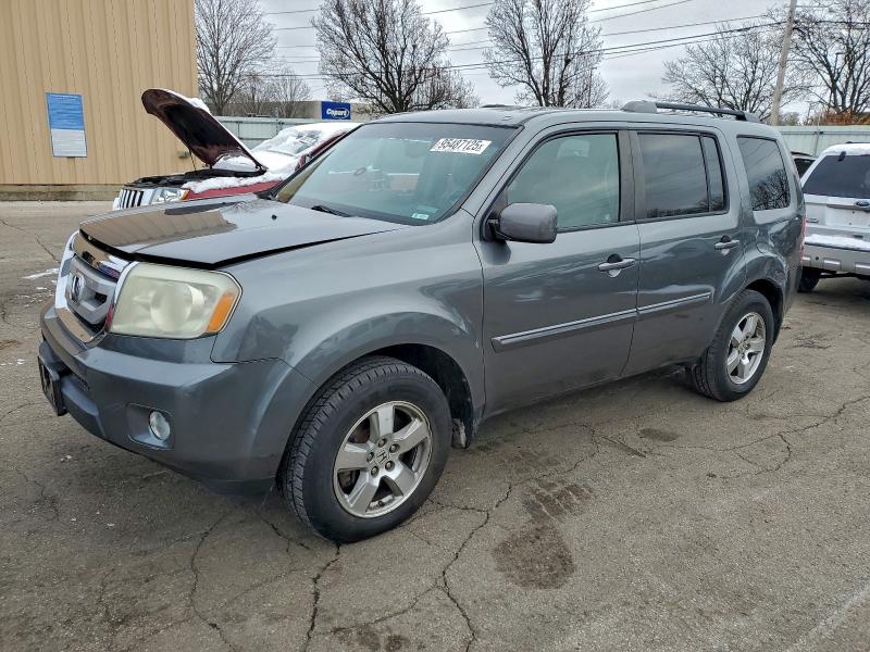 HONDA PILOT EXLN 2011 with VIN 5FNYF4H71BB014925 - Photo from auction